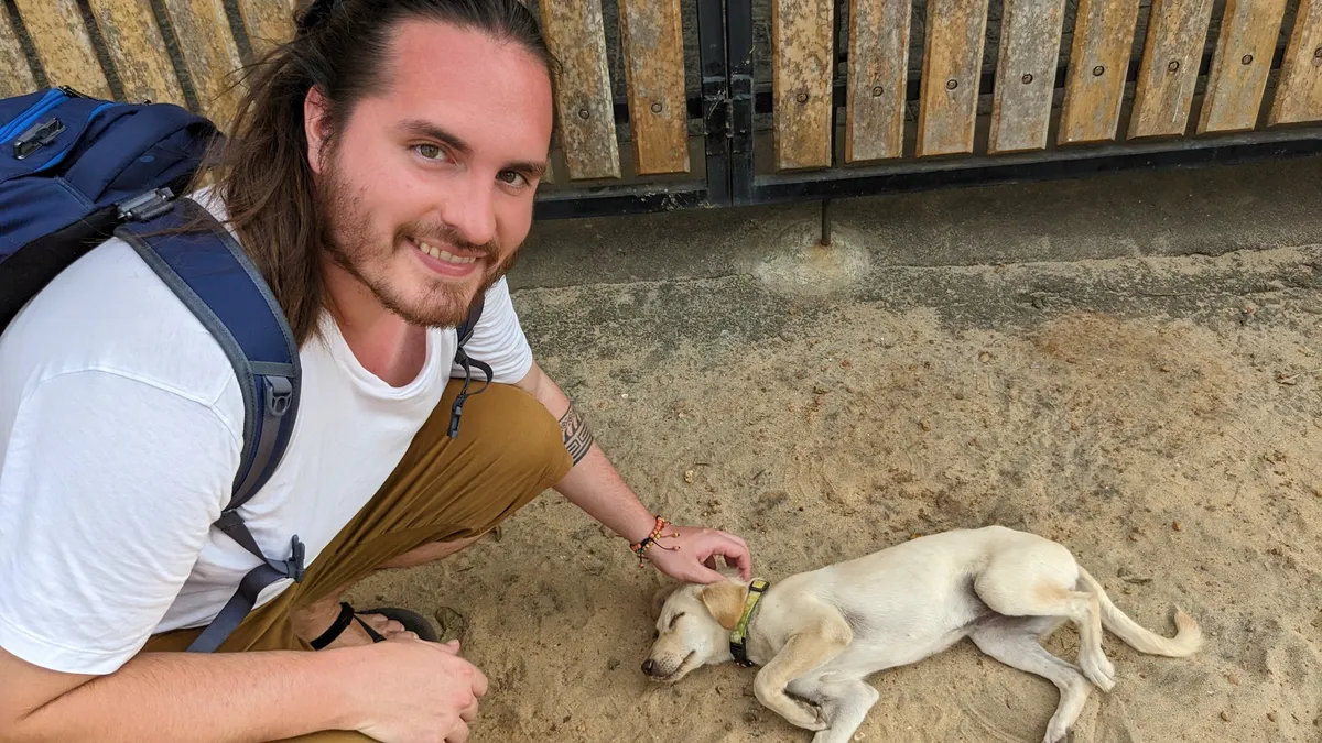 Pete petting a dog